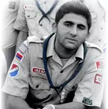 Y. Levon Thomas wearing his scouting uniform in a historical black and white portrait